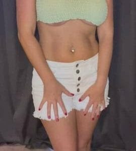 White girl pulling down white shorts and showing white ass and pussy